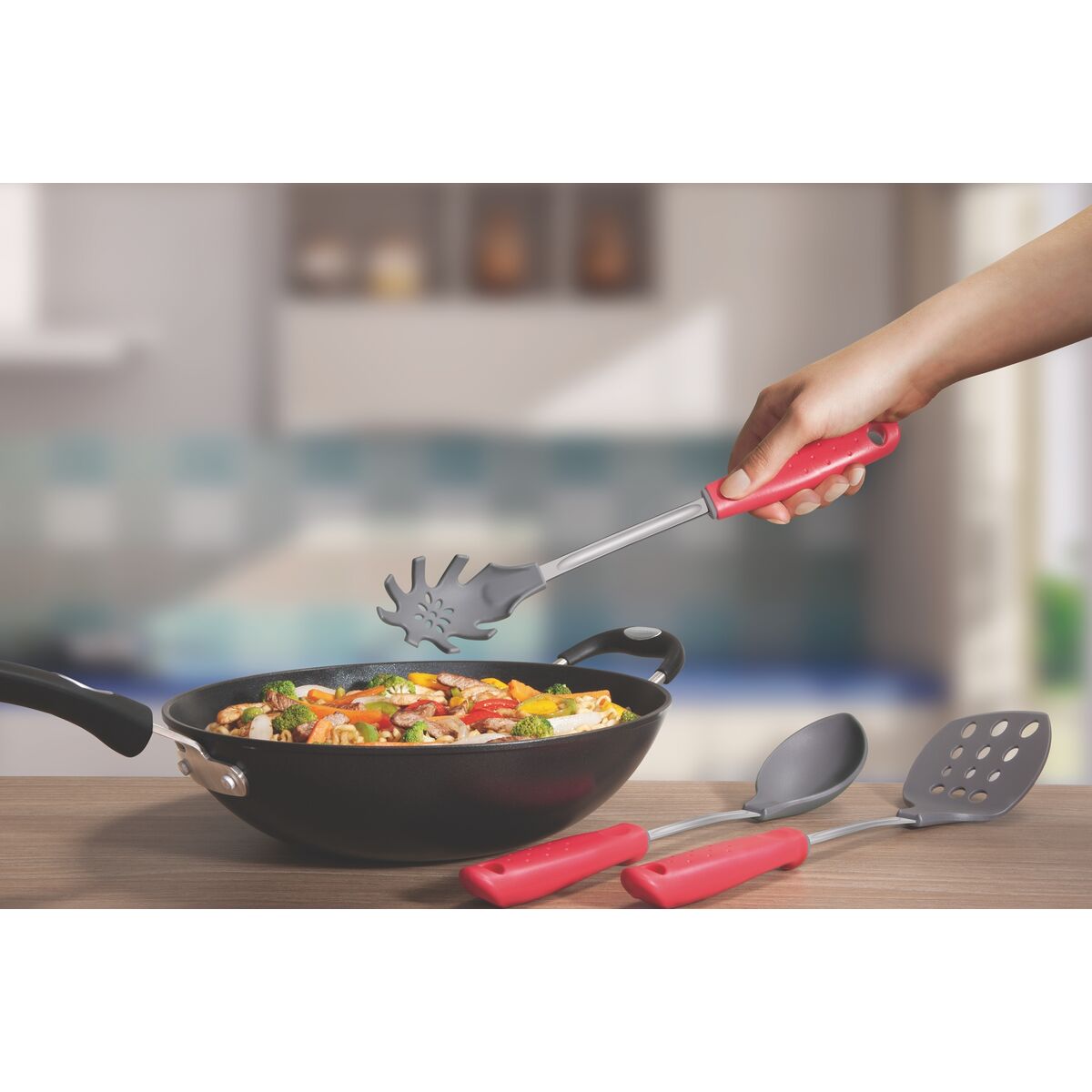Tramontina basting spoon with red handle